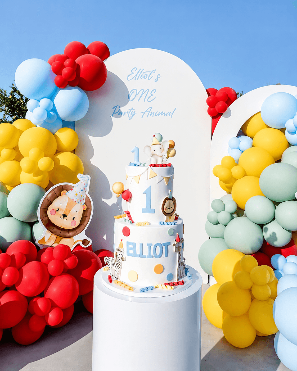 Elliot party cake and balloon setup by Lovelle Patisserie