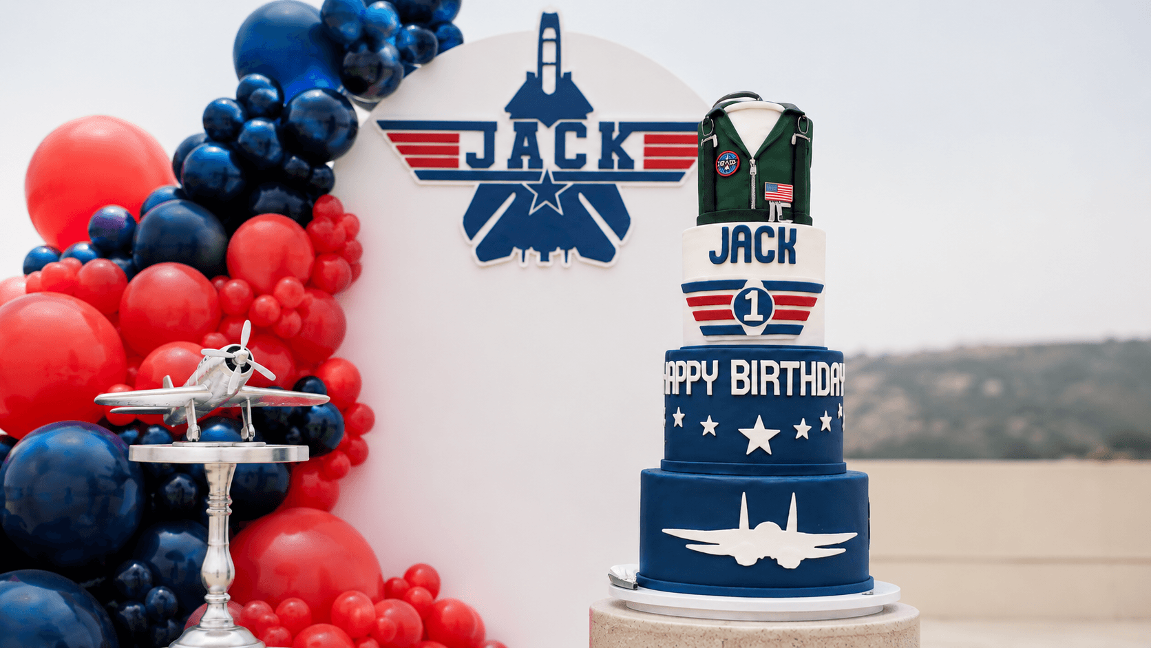 Jack aviation party cake and balloon setup by Lovelle Patisserie