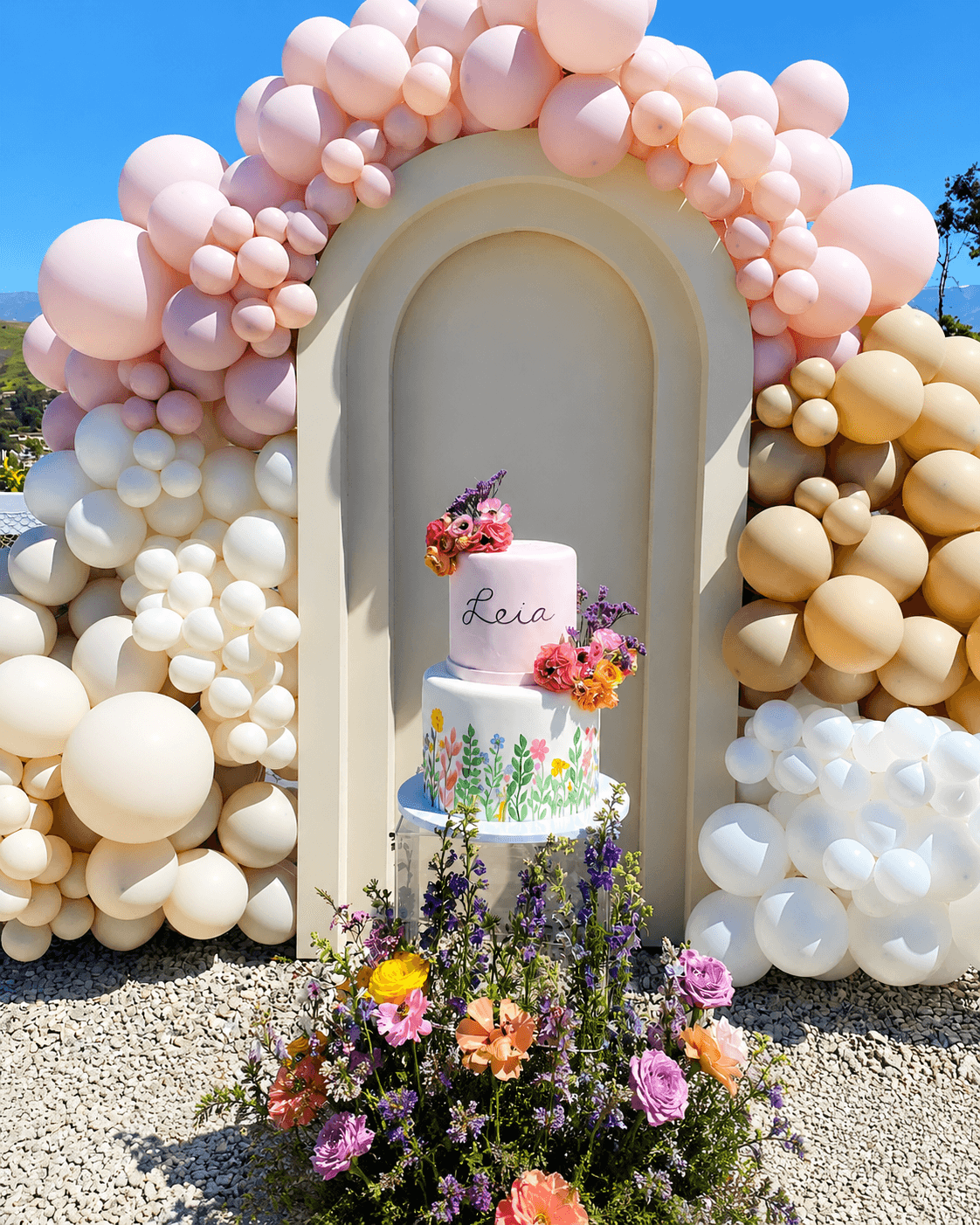 Leia floral party cake and balloon setup by Lovelle Patisserie